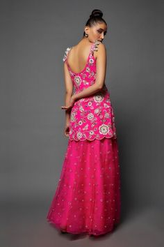 Hot pink short kurta with floral blossom embroidery. Paired with a sharara with mirror buttis and dupatta with tassel work. - Aza Fashions Sleeveless Dori Work Dress For Reception, Sleeveless Sharara For Wedding And Festivals, Sleeveless Sharara For Wedding Festivals, Sleeveless Wedding Gown For Diwali, Sleeveless Dori Work Wedding Dress, Fitted Sleeveless Sharara For Wedding, Blossom Embroidery, Kurta Sharara Set, Neck Flower