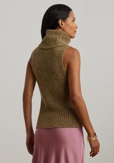 Perfect for layering, this sleeveless sweater is defined by a turtleneck design, a slim silhouette, and a rib-knit construction. This Lauren Ralph Lauren style is realized in a wool-blend fabric with a hint of shimmer for a soft hand feel. Slim fit Intended to hit at the hip Size medium has a 21.5" body length Body length is taken from the high point of the shoulder Turtleneck Pull-on styling Sleeveless silhouette with ribbed armbands Ribbed hem Model is 5'10" (178 cm) and wears a size small Thi Fitted Turtleneck Sweater Vest For Fall, Fitted Sleeveless Fall Sweater, Spring Turtleneck Vest, Fitted Turtleneck Vest For Spring, Fitted High Neck Sweater Vest For Fall, Fitted Sleeveless Knit Top For Winter, Winter Stretch Turtleneck Tank Top, Stretch Turtleneck Tank Top For Winter, Fitted Turtleneck Casual Vest