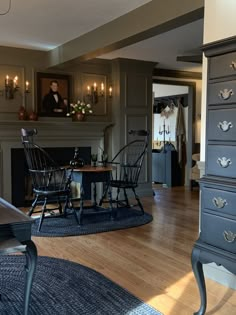 a living room filled with furniture and a fire place