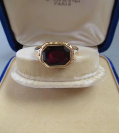 Antique Gold and Garnet Signet Ring - 18K Gold With an 18K gold Hungarian hallmark that was used from 1867. This ring is in very good condition. The head of the ring is 0.497 inches (12.65 mm) long and 0.685 inches (17.42 mm) wide Size of the stone: 0.38 inches (9.58 mm) long and 0.53 inches (13.43 mm) wide Inside diameter: 0.88 inches (22.6 mm) Size: USA 13.5 UK Z1-Z2 EU 71 Weight: 9.7 grams The box is not part of the auction. Free world-wide shipping by FedEx. Estate Yellow Gold Rings For Collectors, Antique Signet Ring With 17 Jewels For Formal Occasions, Heirloom Intaglio Signet Ring For Formal Events, Estate Style Formal Rings With Gemstones, Antique Embellished Signet Ring For Formal Occasions, Antique Gemstone Signet Ring For Anniversary, Classic Engraved Ruby Ring For Formal Occasions, Yellow Gold Estate Jewelry, Estate Gold Ring As Gift