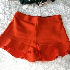 Super Cute Zara Ruffle Shorts Brand New Without Tags Reddish Orange Color Selling Cause I’m Now A Large And It Doesn’t Fit Red Ruffled Shorts, Flirty Red Bottoms For Summer, Flirty Red Summer Bottoms, Red Ruffled Shorts For Spring, Ruffled Bottoms For Spring Date Night, Ruffled Bottoms For Date Night In Spring, Spring Date Night Ruffled Bottoms, Trendy High Waist Bottoms With Ruffle Hem, Ruffle Hem Shorts For Day Out