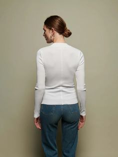 The perfect white, mock neck in our responsible Organic Rib. Use it as a layering piece or wear on it's own. Elegant White Top With Ribbed Collar, Elegant White Tops With Ribbed Collar, Casual White Turtleneck Top, Classic White Ribbed Turtleneck, White Ribbed Fitted Turtleneck, Turtleneck With Ribbed Neckline For Layering, Classic White Long Sleeve Turtleneck, Classic Turtleneck Top In Winter White, White Ribbed Turtleneck For Layering