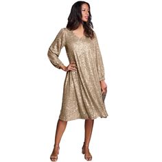 Step into the spotlight with the Roaman's Women's Plus Size Sequin Swing Dress, a dazzling ensemble designed to make you shine at any event. 

- Size: 18/20
- Color: Sparkling Champagne
- Material: Sequin mesh
- Gender: Female
- Age Group: Adult

This dress features a charming V-neck and a flowing swing silhouette that ensures graceful movement, while the long blouson sleeves with elasticized cuffs add a touch of sophistication. Fully lined at the body for comfort, this dress is perfect for even