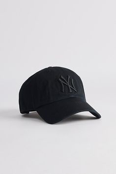 a new york yankees baseball cap on a white background