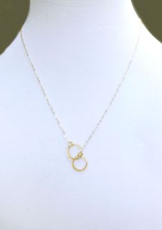 "Infinity Circle Lariat Necklace - Available in Gold, Rose Gold or 100% Sterling Silver A simple and dainty necklace ~ So simple & pretty! - 24k gold vermeil or sterling silver small circles measure about 12mm - Dainty circles attach to a shimmery 14k gold fill, sterling silver or rose gold fill chain - Total necklace length including circles is shown at 19\" - Model has size small neck - Please see measuring instructions to get the right length for you - Necklace closes with a 14k gold fill Minimalist Infinity Clavicle Chain Necklace, Minimalist Lariat Necklace For Anniversary, Simple Necklace For Bridesmaid Gift, Minimalist Jewelry For Bridesmaids, Simple Anniversary Necklace, Simple Charm Necklace With Adjustable Chain, Dainty Lariat Necklace With Round Pendant For Gift, Minimalist Sterling Silver Lariat Necklace As A Gift, Adjustable Nickel-free Infinity Necklace