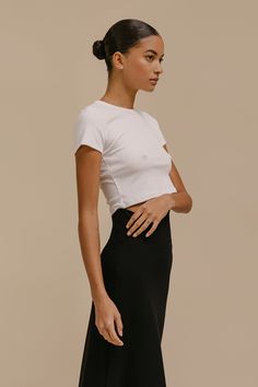 The perfect high waist pant companion. The Kelly Crop Slim Fit Tee is a nostalgic silhouette cut in our anything-but-basic cotton rib. Featuring a crew neckline, a just right cropped length, and clean, tailored finishing. Silhouette Cut, Workout Tee, High Waisted Pants, Crew Neckline, Scoop Neck, High Waist, Slim Fit, High Waisted