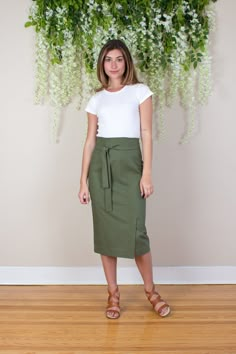 "Pull together the perfect mix of casual and professional style in your look with this ultra high waisted linen midi pencil skirt.  Raised waist, separate tie / belt, front vent and fitted silhouette with a below the knee hem. Medium weight linen blend fabric with a slight stretch is fully lined with a soft airy cotton voile to keep you cool and comfortable.  Invisible zipper closure on back.  Composition: 55% Linen, 43% Rayon, 2% Spandex  Lining: 100% Cotton Care: Dry clean recommended. Hand wa Versatile Long Lined Skirt, Relaxed Long Cargo Skirt For Work, Relaxed Fit Long Cargo Skirt For Work, Lined Asymmetrical Skirt For Work, Fitted Cargo Pencil Skirt For Spring, Asymmetrical Lined Skirt For Work, Workwear Midi Cargo Skirt, Elegant Fitted Cargo Skirt For Spring, Flowy High Waist Mini Skirt For Workwear