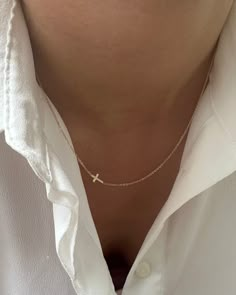 This simple cross necklace is both understated and significant, perfect for daily wear and layering with other necklaces. Ideal for a confirmation or baptism present, this minimalistic necklace features a delicate chain and a dainty 14k gold cross.• Mini Cross measures 5x9mm• Charm and chain is made of 14k gold• Available in 14k yellow gold white gold and rose gold Dainty Gold Jewelry Aesthetic, Cross Necklace Aesthetic, Simple Cross Necklace, Christmas List Inspo, Small Cross Necklace, Simple Gold Jewelry, Minimalistic Necklace, Cross Necklace Simple, Sideways Cross Necklace