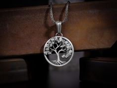 Yggdrasil the world tree necklace pendant for men or women, Engraved futhark runes sterling silver necklace, Scandinavian silver men jewelry Scandinavian sacred Tree of Life - Yggdrasill. This giant ash tree supports the universe, it grows through all the worlds. This sterling silver pendant is refined Yggdrasill's whimsical interweaving of branches and roots symbolizing the commonality of all nine worlds. This beautiful life of tree necklace is made of 925 sterling silver and decorated with spe Necklace Pendant For Men, World Tree, Sacred Tree, Futhark Runes, Ash Tree, Pendant For Men, Tree Necklace, Polish Silver, Mens Pendant