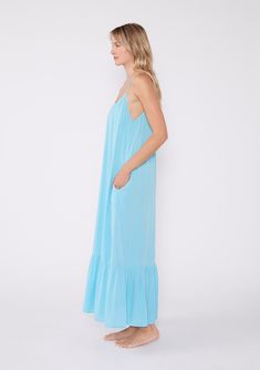 An ultra-flowy sleeveless spring maxi tank dress with a sheer lace racerback detail. Relaxed, flowy fit Sleeveless Maxi length Tiered skirt Scoop neckline Spaghetti straps Sheer lace racerback detail Side pockets Flowy bohemian maxi dress From the beach to the streets, our flowy bohemian maxi dress will keep you comfortable and chic all spring and summer long. With a long tiered skirt, spaghetti straps, and a sheer lace detail at the back. Model is 5'9, wearing a size S.Style: I-73422W-SBN Flowy Maxi Dress With Adjustable Straps, Flowy Sleeveless Mini Dress, Flowy Maxi Dress With Spaghetti Straps For Daywear, Breezy Maxi Dress With Adjustable Straps, Daywear Slip Dress With Adjustable Straps In Maxi Length, Maxi Length Slip Dress With Adjustable Straps For Daywear, Breezy Flowy Maxi Dress With Spaghetti Straps, Sleeveless Maxi Dress With Adjustable Straps For Brunch, Airy Spring Daywear Maxi Dress