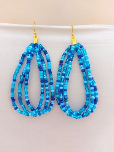 Statement turquoise blue dangling earrings, boho earrings, large hoop earrings, aqua beach earrings, for her , women earrings ❤SIZES This item measures about 3 inches long but it can be made in any length you like. Simply contact me if you need a different size. ❤ PROCESSING AND SHIPPING Most orders are made and shipped out in one business day. Please check delivery timeframes for your location on the description below.   ❤ CUSTOM ORDERS Contact me to discuss you needs!  Statement turquoise blue dangling earrings, boho earrings, large hoop earrings, aqua beach earrings, for her , women earrings Blue Earrings With Ear Wire For Festival, Handmade Light Blue Beaded Earrings For Beach, Blue Hoop Jewelry For The Beach, Blue Hoop Earrings For Summer Festivals, Light Blue Beaded Earrings For The Beach, Handmade Teardrop Hoop Earrings For Beach, Blue Hoop Earrings With Ear Wire, Bohemian Blue Hoop Earrings For Festivals, Handmade Bohemian Teardrop Earrings For Beach