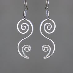 "This unique floral dangling earrings are handmade either from sterling silver. The principles of beauty and grace realized in serpentine lines. S curves modulate from one gradient to another. The \"S\" curves signify liveliness and activity and excite the attention of the viewer. They are \"The Line of Beauty\" The Length of the earrings is 1 inches, 25mm, excluding the earring hook. ;-) My contact number: 909-822-8348. Please contact me if you would like to order multiples or customize a desig Minimalist Sterling Silver Swirl Earrings, Modern Twist Dangle Jewelry For Gifts, Elegant Sterling Silver Jewelry With Artistic Design, Swirl Shaped Sterling Silver Earrings For Gifts, Sterling Silver Swirl Jewelry Gift, Sterling Silver Swirl Earrings For Gift, Sterling Silver Swirl Jewelry As A Gift, Minimalist Silver Swirl Earrings, Elegant Handmade Swirl Earrings