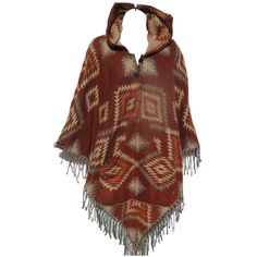 One-of-a Kind !!!…Unique Yak Wool Tasseled Fringe 2 Button Poncho with a Hoodie and Pockets…!!! …Slip on a soft, ultra warm Yak Wool Blend Unisex Poncho on a cool, breezy Autumn day or night… Each 2 Button Neck-Line Yak Wool Blend Poncho is handmade from the Yak Wool Shawls/Throws sold by Tribal Designs by Neela.   --  Each Poncho is Unique --  Handcrafted  --  Design cut from our Yak Wool Blend Shawls Handloomed by Artisans --  One Size Fits Most --  Tassel/Fringe on front side of each Poncho --  Two Button V Neck --  Hoodie --  Extra Large Pockets for Both Hands These Ponchos are made from a special blend of Yak Wool and Polar Fleece.  The material contained in each shawl is Hand loomed in Nepal or India in designs generated from tribal family patterns. The yarn used in this piece appear Bohemian Hooded Poncho For Fall, Bohemian Brown Poncho For Festivals, Hippie Brown Poncho For Festivals, Brown Bohemian Poncho For Festivals, Hippie Brown Poncho For Winter, Bohemian Brown Outerwear With Tassels, One Size Bohemian Alpaca Poncho, Handmade Bohemian Alpaca Poncho, Folk Style One-size Poncho For Winter