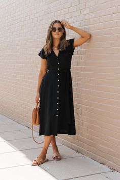 This Black Button Down Midi Dress is a sophisticated and versatile piece perfect for a variety of occasions! Made from a blend of linen and rayon, this dress combines breathability with a smooth, soft texture, ensuring comfort and style. Features a notched collar, a button down front, and a tie belt that cinches at the waist, accentuating your figure and adding a customizable fit. Style it with flat sandals and a wide-brimmed hat for a comfortable yet stylish weekend look! Casual Everyday Dresses, Summer Work Dresses, Casual Work Dress, Button Down Midi Dress, Short Sleeve Midi Dress, Brimmed Hat, Work Dresses, Button Front Dress, Midi Short Sleeve Dress