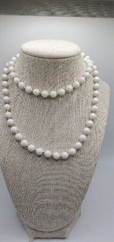 Vintage Monet White Plastic Bead and Gold Tone 30" Necklace White Beaded Chain Necklace, White Long Beaded Necklace With Round Beads, White Beaded Long Necklace With Round Beads, White Beaded Chain Necklaces, White Long Necklace With Round Beaded Chain, White Long Necklace With Round Beads For Gift, White Necklace With 8mm Beads, White Single Strand Necklace With Round Beads, White Long Necklace With Round Beaded Details