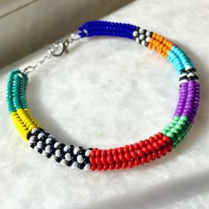 This handmade beaded woven bracelet is carefully hand-woven from the highest quality glass seed beads! Boho style bracelet in vibrant colors sits elegantly on your wrist thanks to its stainless steel extension chain. Multicolor beaded bracelet, compatible with all your clothes that you can use in all seasons, is the ideal handmade gift accessory for you and your loved ones! Unique bracelet guaranteed to get all the compliments! You can click the link for my other handmade jewelry and accessories Multicolor Braided Bead Bangle Bracelet, Multicolor Braided Bracelet Bangle, Multicolor Braided Bangle Bracelet, Multicolor Handwoven Beaded Bracelets For Friendship, Multicolor Handwoven Beaded Friendship Bracelets, Handwoven Beaded Bracelets With Round Beads, Multicolor Beaded Braided Bracelets, Handwoven Multicolor Braided Bracelets, Multicolor Hand-strung Braided Bangle Bracelet