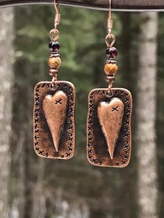 Unique copper heart earrings with Garnet and picture jasper gemstones. You will love these antique copper steam punk heart earrings! Garnet is the stone of love, and it is the perfect complement to the picture jasper stone. These earrings are 2 inches long and 5/8 of an inch wide. They are slightly heavier than most of my other earrings, but not too heavy. Weight is 3.8 grams. The French ear wires are solid copper. All my jewelry comes gift boxed with a custom Shelly Mariposa Design butterfly ca Handmade Bronze Jewelry For Valentine's Day, Handmade Copper Heart Pendant Jewelry, Unique Heart-shaped Earrings, Brown Steampunk Jewelry Gift, Steampunk Brown Jewelry For Gift, Steampunk Brown Jewelry For Gifts, Steampunk Brown Jewelry Gift, Vintage Brown Heart-shaped Jewelry, Handmade Antique Copper Earrings