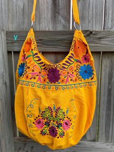 "Super Cute Floral Embroidered Bag from Puebla, Mexico Overview *Thread material * Cotton Fabric *approximate measurements: 13\" from bottom to zipper area & 15-16 with if expanded *handmade *Design colors may vary per purse as all are embroidered with unique colors * Closure is zipper or magnetic button - you can specify in notes section @ checkout which one you prefer * One pocket inside Care *hand wash only *delicate care *hang dry Please email me your questions before buying. All of my i Embroidered Satchel Hobo Bag For Daily Use, Cotton Bags With Multicolor Embroidery, Bohemian Cotton Bag With Floral Embroidery, Bohemian Cotton Bags With Floral Embroidery, Yellow Embroidered Bag For Daily Use, Yellow Embroidered Shoulder Bag For Daily Use, Everyday Multicolor Embroidered Bag, Yellow Embroidered Travel Bag, Yellow Embroidered Tote Bag