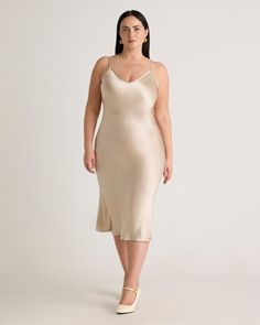 We love the midi length and bias cut of this dress. This super flattering fit is made from 100% mulberry silk, in a satin finish, and is now available in extended sizes. The kicker? Our silk is washable. Easy to style, easy to wash for low-maintenance luxe. Plus, silk fiber contains 18 kinds of amino acids that make it amazing for skin nourishment, hypo-allergenic, and naturally thermoregulating to help maintain body temperature.Also offered in sizes XS-XL. Satin Knee Length Dress, Silk Dresses Outfit, Wish List Clothes, Silk Fiber, Midi Dress Plus Size, N Shoes, Silk Cami, Quarter Zip Sweater, Silk Slip Dress