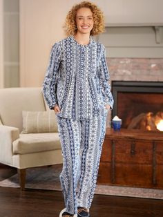 These lightweight flannel pajamas are so festive, you might even call them Christmas pajamas - but you'll want to wear them all winter long! The breathable cotton flannel is soft and cozy and brushed inside and out for added loft and comfort. These fun snowflake pajamas include a pullover top with a Henley-style button placket and button cuffs - both with dyed-to-match buttons. The pajama top is also styled with a yoke in the back and inverted pleats for ease of movement. The matching pajama pan Blue Cotton Holiday Sleepwear, Nordic Snowflake Pattern, Matching Pajama Pants, Nordic Snowflake, Long Pajama Pants, Flannel Nightgown, Vermont Country Store, Matching Pajama, Flannel Pajama Sets