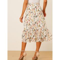 Featuring pretty ditsy floral prints, this midi skirt is a summer option that can be worn with just about anything. Channel elegant style in this midi skirt which is beautifully printed with a blossom pattern for a versatile look. It is made of lightweight fabric, adding definition to the free-flowing design. Falling to a waterfall midi hem, it sits high on the waist with a discreet side zip fastening. Summer days call for effortlessly feminine styles like skirts. Non-stretch Summer Midi Skirt, Spring Knee-length Ruffled Skirt, Casual Floral Print Midi Skirt, Casual Midi Skirt With Floral Print, Summer Floral Print Tiered Skirt, Knee-length Floral Print Skirt For Garden Party, Spring Floral Print Skirted Bottoms, Vacation Ruffled Midi Skirt, Vacation Midi Ruffled Skirt