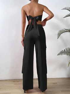 Exude effortless sophistication with our Solid Tube Top And Flap Pocket Side Cargo Pants. These pants are the perfect blend of style and functionality, featuring a solid colorway and flap pockets for extra storage. Whether you’re going for an edgy or classic look, these pants will cover you in all the right ways while the top will simply add to its elegance. Available in elegant black, striking orange, and a muted grey. Specifications: Pattern Type: Plain Details: Asymmetrical, Button, Pocket, T Versatile Pants With Pockets For Day Out, Versatile Pants For Day Out, Chic Parachute Pants With Pockets, Chic High Waist Parachute Pants With Side Pockets, Chic High-waist Parachute Pants With Side Pockets, Chic Solid Color Summer Cargo Pants, Chic Cargo Pants With Pockets For Day Out, Wide Leg Trousers With Pockets For Day Out, Ankle-length Cargo Pants With Pockets For Day Out