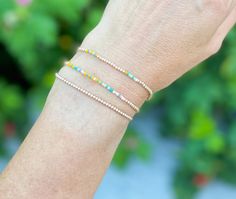 Introducing the Pixie Stack. The daintiest little stack you ever did see. Handmade with love (and very focused eyes), these three bracelets are crafted with 2MM Gold-Filled Beads and a splash of colorful Japanese Miyuki Beads in turquoise, cream, pink and tangerine. It is the perfect stack to wear alone or to add to your wrist party! Dainty 14k Gold-filled Bracelets With Colorful Beads, Everyday 14k Gold Filled Beaded Bracelets With Tiny Beads, Handmade Dainty Yellow Gold Beaded Bracelets, Handmade Yellow Gold Dainty Beaded Bracelets, Dainty Yellow Gold Beaded Bracelets For Friendship, Dainty Beaded Bracelets With Tiny Beads For Everyday, Dainty Everyday Beaded Bracelets With Tiny Beads, Dainty Gold Beaded Bracelets, Dainty Beaded Bracelets With Tiny Beads As A Gift