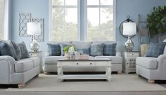 a living room with blue walls and furniture