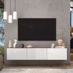 a living room with a large flat screen tv mounted to the side of a wall