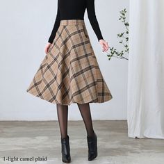 "★★ FEATURES * Wool skirt * Polyester lining * Two side seam pockets * Right zipper closure * back little elastic band * Plus size full skirt * A Line Skirt * Perfect for Winter, autumn * Dry clean ★★ The model is 170 cm (5′ 7″) tall with a 80 cm (31.5\") bust, 66 cm (26\") waist. She is wearing the plaid wool skirt in size XS. ★★ Bespoke Order Service If you Request other color Request the length Your height is not between 155 cm- 172 cm Your weight is over 75 kg I can do it for you, It will ne Knee Length Plaid Skirt Outfit, Fitted Beige Skirt For Winter, Casual Knee-length Winter Skirt, Casual A-line Winter Skirt, Beige Winter Midi Skirt, Winter Beige Lined Skirt, Brown Lined Skirt For Winter, Winter Skirt With Pockets, Casual Brown Skirt For Winter