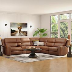 a living room filled with furniture and a large painting on the wall above the couch