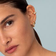 Delicate and fashion dainty ear cuff made to wear it at the lobe of the ear, no piercing needed, is made of 925 Sterling Silver 18kt gold plated with cubic zirconia gemstones. Details: * 925 Sterling Silver 18kt gold plated * Also available in 925 sterling silver.  * Nickel free * Sold individually * White Zircon  All jewellery comes in beautiful packaging, gift-ready. Made with love! Feel free to contact me with any questions :) Visit our e-shop http://www.bylia.es and take a look at By Lía ETS Wedding Ear Cuff With Diamond Accents And Cubic Zirconia, Wedding Ear Cuff With Diamond Accents In Cubic Zirconia, Trendy Yellow Gold Cubic Zirconia Jewelry, Trendy Gold Plated Ear Cuff, Trendy Yellow Gold Tarnish Resistant Ear Cuff, Trendy Tarnish Resistant Yellow Gold Ear Cuff, Cubic Zirconia Ear Cuff With Diamond Accents As Gift, Gift Cubic Zirconia Ear Cuff With Diamond Accents, Gold Plated Ear Cuff