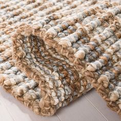 an image of a rug that looks like it is made out of wool and yarn