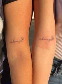 two people with tattoos on their arms that say, always love and always laugh in cursive writing