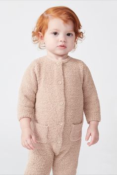 Cuddle up to this super soft & cozy one-piece Long Sleeve Romper for baby! Crafted from 100% recycled materials for maximum lounge-ability and with center buttonsfor easy access to baby's diaper ―baby will never want to take it off.Designed to stay close to body with its soft fitted fuzzy look for the utmost comfort. If you're looking for comfy, this jumpsuit is for you!