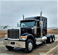 a large semi truck parked in a parking lot