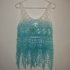 Breeze Ever Small Ombr Crochet Top Sleeveless Ombre Crochet Top, White Sleeveless Crochet Top For Festival, Sleeveless Blue Lace Tops, Blue Lace Sleeveless Tops, Sleeveless Crochet Lace Top For Beach Cover-up, Blue Lace Tops For The Beach, White Sleeveless Crochet Top For Beachwear, White Bohemian Tank Top For Beach, Blue Sleeveless Tank Top For The Beach