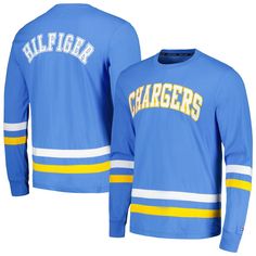 The Tommy Hilfiger Nolan Long Sleeve T-Shirt is the perfect way to show your unwavering support for the Los Angeles Chargers. This stylish tee features embroidered fabric applique and screen print graphics that proudly display the Chargers logo, a must-have for any dedicated fan. The comfortable cotton material ensures you'll stay comfortable while cheering on your team, whether you're at the stadium or watching from home. Collegiate College Tops With Embroidered Logo, Collegiate Tops With Embroidered Logo For College, Blue College T-shirt With Embroidered Logo, Blue Cotton T-shirt With Embroidered Logo, Fitted Crew Neck Top With Embroidered Logo, Collegiate Embroidered Crew Neck T-shirts, Collegiate Tops With Embroidered Graphics For College, Long Sleeve Cotton T-shirt With Team Spirit, Blue Relaxed Fit T-shirt With Embroidered Logo