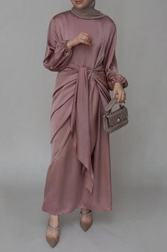 Ulaa maxi abaya dress with detached apron elasticated sleeve like tie waist piece in satin pink - ANNAH HARIRI Modest Pink Abaya For Spring, Pink Modest Abaya For Spring, Pink Long Sleeve Satin Dress, Eid Long Sleeve Satin Dress, Long Sleeve Satin Dress For Eid, Elegant Pink Maxi Dress With Gathered Sleeves, Eid Satin Maxi Dress, Long Sleeve Pink Maxi Dress With Gathered Sleeves, Pink Long Sleeve Maxi Dress With Gathered Sleeves