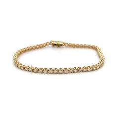 This 14k yellow gold diamond tennis bracelet features a total carat weight of 2.00. The diamonds are set in a 4-prong setting, creating a classic and elegant look. Perfect for adding a touch of sparkle to any outfit. Classic 14k Gold Diamond Bracelet With Vvs Clarity, Classic Gold Bracelet With Brilliant Cut, Timeless Gold Bracelet With Brilliant Cut Diamonds, Elegant Yellow Gold Diamond Bracelet With Brilliant Cut, Elegant Yellow Gold Brilliant Cut Diamond Bracelet, Classic Diamond Tennis Bracelet With Accents, Classic White Gold Bracelet With Prong Setting, Classic Round Gold Bracelet With Diamonds, Classic Gold Diamond Bracelet With Round Cut