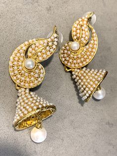 Traditional Bollywood Statement Earrings, Glamorous Indian Pearl Wedding Bell Dangles These beautiful Hollywood Regency /Bollywood Style are both Ornate and at 7mm long - make an elegant statement too! They are perfect for the holiday season- romantic and festive - and would Look lovely ringing in the New Year on New Years Eve! And Pearl is super trending, too!! If you are getting married they compliment a number of styles from Boho Glam to tribal & yoga inspired themes to more traditional v Glamorous Wedding Earrings For Festive Occasions, Glamorous Wedding Earrings For Festive Season, Glamorous Festive Wedding Earrings, Festive White Bridal Earrings With Elegant Design, Dangle Bridal Earrings For Weddings And Festivals, Wedding And Festival Pearl Drop Earrings, White Bridal Earrings For Reception And Festivals, Dangle Bridal Earrings For Weddings, Heavy White Bridal Earrings For Reception