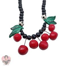 Pre-Owned Costume Jewelry Should Be Fun And That Can Certainly Be Said About The Whimsical And Never Boring Jewelry Created By Both Parrot Pearls And Flying Colors. Although They Are Contemporary They Are Already Quite Collectable And It Is Easy To See Why. This Bold Necklace Has Seven Bright Red Cherries That Dangle From The Center. Veined Green Leaves And Two Black Beads With White Polka Dots Are Strung Along With Black Rounds. The Clasp Is A Silver- Tone Barrel. The Hallmark Appears On This Whimsical Piece. Ca. 1980s. Cherry Beaded Necklace, Bold Necklace, Black Beads, White Polka Dot, Bright Red, Vintage Ceramic, Green Leaves, Costume Jewelry, Womens Jewelry Necklace