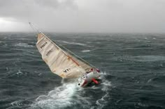 a sailboat in the middle of choppy water