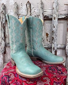 Experience top-notch comfort, unbeatable durability, and superior craftsmanship when you slip into these Roper boots! Exuding timeless western fashion, they feature a square toe, waxy light blue leather vamp & shaft, and Aztec embroidered 11" shaft, all atop a walking-friendly 1 3/8" heel with a removable REST inso Western Turquoise Boots With Patina, Turquoise Western Boots With Patina, Country Style Fitted Boots With Square Toe, Country Style Fitted Square Toe Boots, Turquoise Western Boots For Ranch, Western Turquoise Boots For Rodeo, Western Style Blue Boots With Square Toe, Fitted Turquoise Boots For Ranch, Turquoise Western Boots With Snip Toe