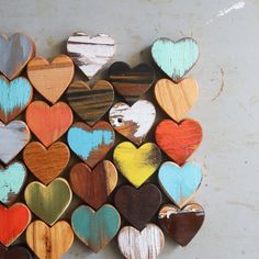 several wooden hearts are arranged in the shape of a heart