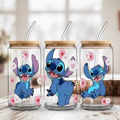 three glass jars with cartoon characters on them