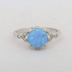 Vintage Sterling Silver Blue Opal & White Topaz Ring ...Marked 925...Total of weights 2.0grams...Size 9...Measure of Face 9.2MM...It's in very good condition. Topas Ring, Opal White, Solitaire Rings, Topaz Ring, Blue Opal, White Topaz, Silver Blue, Solitaire Ring, Sterling Silber