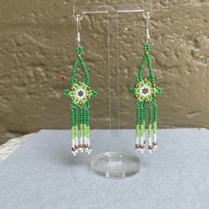 Handmade With Czech Glass Seed Beads And 925 Sterling Silver Hooks By A Young Chicana Artist. Please Allow 2 Weeks To Be Made And Shipped. Some Flexibility With Colors, Comment For Any Questions! Make A Bundle Of 3 For Free Shipping Artisan Flower Earrings With Ear Wire, Elegant Adjustable Flower Shaped Beaded Earrings, Green Bohemian Earrings With Bead Caps, Green Bohemian Beaded Earrings In Sterling Silver, Bohemian Green Beaded Sterling Silver Earrings, Traditional Dangle Jewelry With Bead Caps, Adjustable Flower-shaped Earrings With Dangling Beads, Adjustable Flower Earrings With Dangling Beads For Gifts, Green Sterling Silver Beaded Earrings With Round Beads