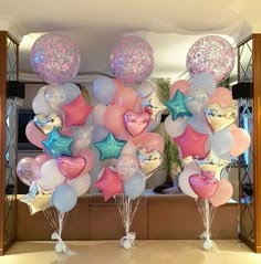 some balloons are in the shape of hearts and stars