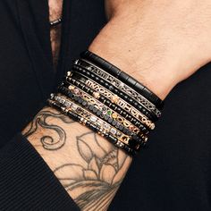 Elevate your fashion game with this Stretch Carbon Fiber Bracelet. Featuring five rows of black diamonds, black ceramic and carbon fiber beads all seamlessly integrated into a stretchable design, this piece adds a contemporary edge to any style. Available in 18K White, Yellow, and Rose Gold Black Diamond weight = 0.40 carats Wrist Sizes: L = 7in to 7.5in XL = 7.5in to 8in XXL = 8in to 8.5in Please contact us for custom sizes Luxury Black Bracelets, Luxury Black Bracelet Jewelry, Luxury Black Beaded Jewelry, Elegant Black Bracelet With Strap, Luxury Adjustable Black Jewelry, Elegant Black Bracelets, Modern Black Bracelets With Black Diamonds, Luxury Black Bracelets With Black Diamonds, Luxury Adjustable Black Wristband